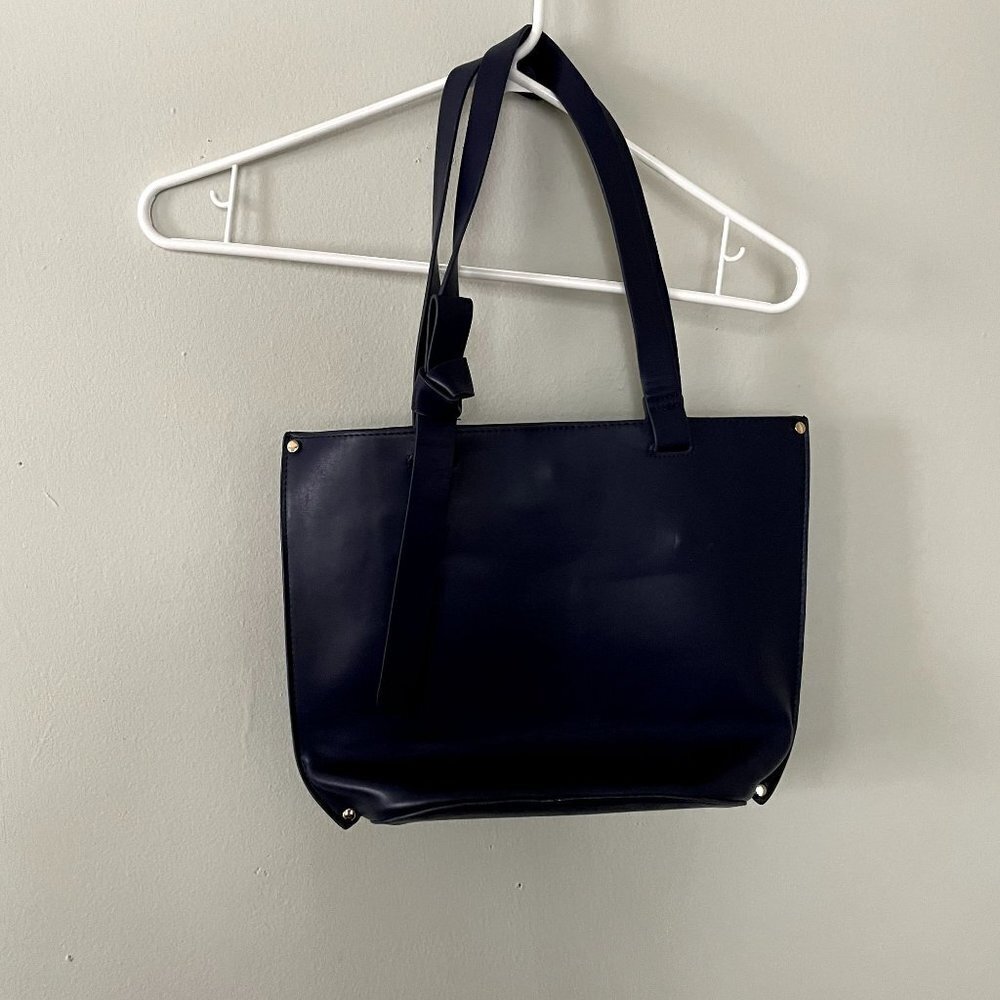 a new day navy blue spacious shoulder handbag zipper inner pocket clasp bow